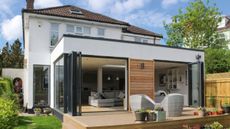 Single storey rear extension ideas: house extension with cladding and bi fold doors lleading onto outdoor decking image by William Goddard
