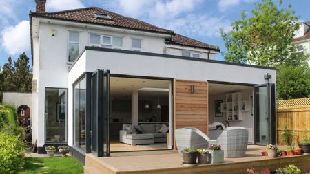 Single storey rear extension ideas: house extension with cladding and bi fold doors lleading onto outdoor decking image by William Goddard