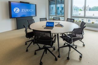 A small conference room at Zurich Insurance with displays integrated by WSDG.
