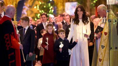 Catherine, Princess of Wales, Prince Louis of Wales, Princess Charlotte of Wales and Prince George of Wales process out of The "Together At Christmas" Carol Service at Westminster Abbey on December 08, 2023