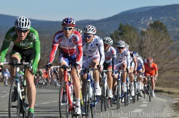 The peloton strung out up the climb