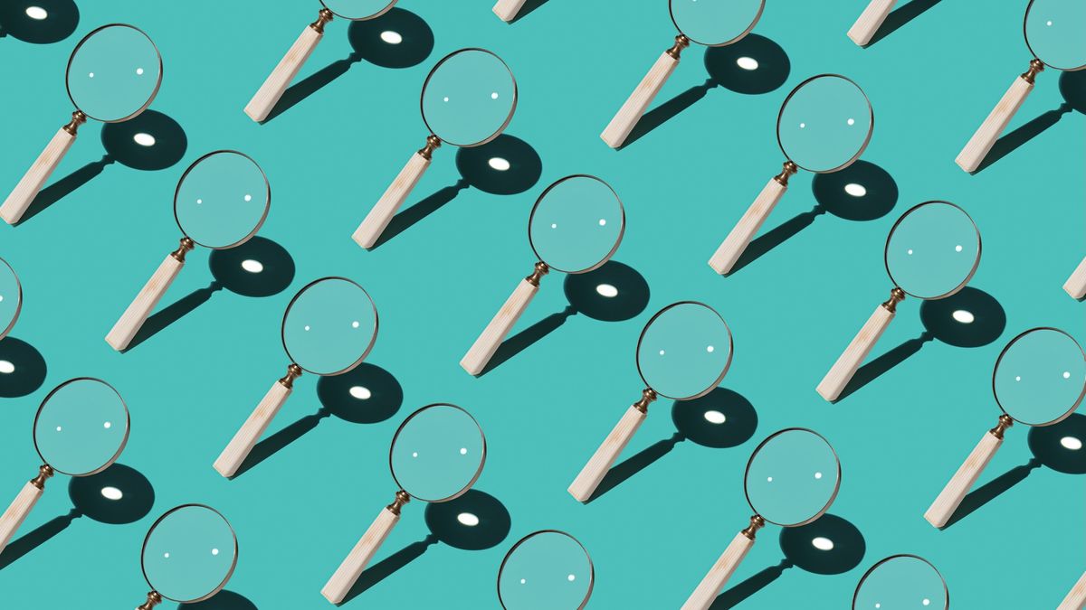 Repeating pattern of magnifying glasses on a turquoise background