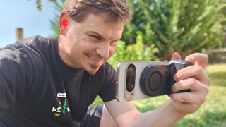 Using a KraftGeek magnetic camera grip attached to a Google Pixel 10 Pro XL to take a photo