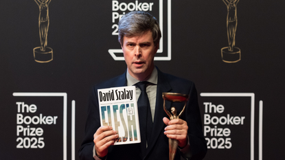 David Szalay with his trophy after winning the Booker Prize 2025