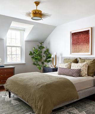 bedroom with khaki linen bedsheets and airy color palette