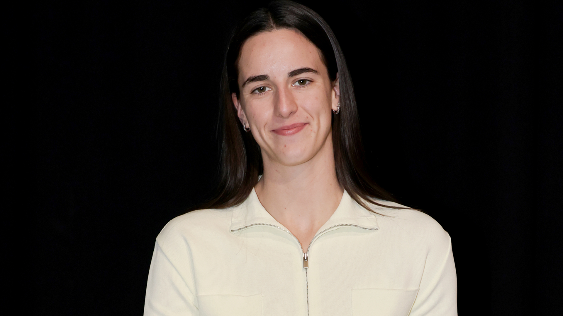 Caitlin Clark styled the butter yellow color trend in her latest tunnel walk outfit