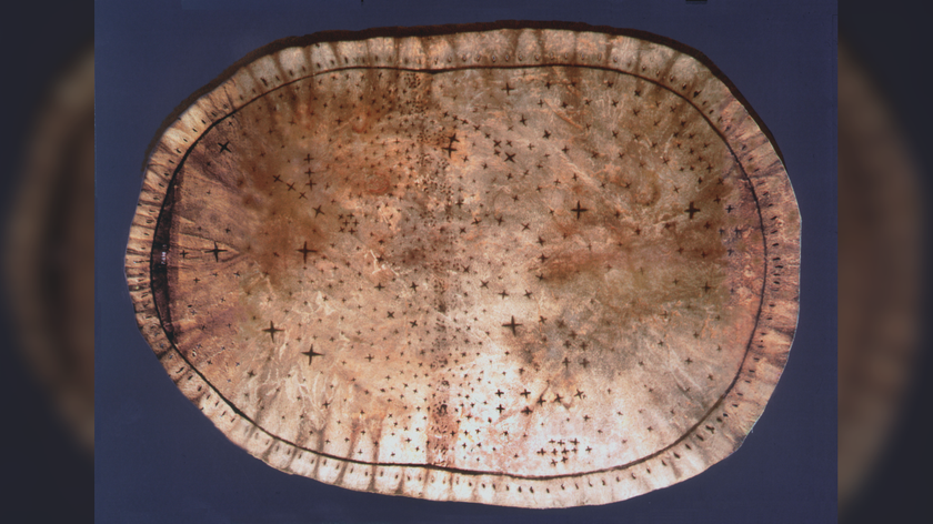 an oval piece of tanned hide with stars inscribed on it