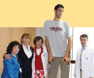 The world's tallest living man Sultan Kosen poses with (left to right) Sophie Yu, Kelly Garrett, Dr. Mary Lee Vance, and Dr. Jason Sheehan during a visit to the University of Virginia Medical Center. 