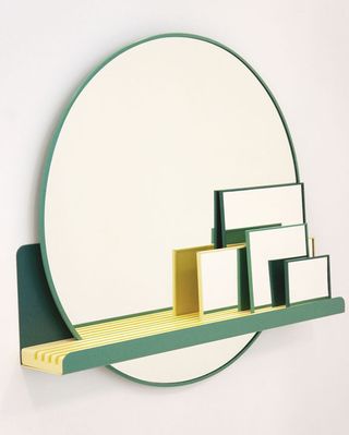 Gina Heltorp Andersen's wall-mounted shelf supports an array of green-rimmed mirrors