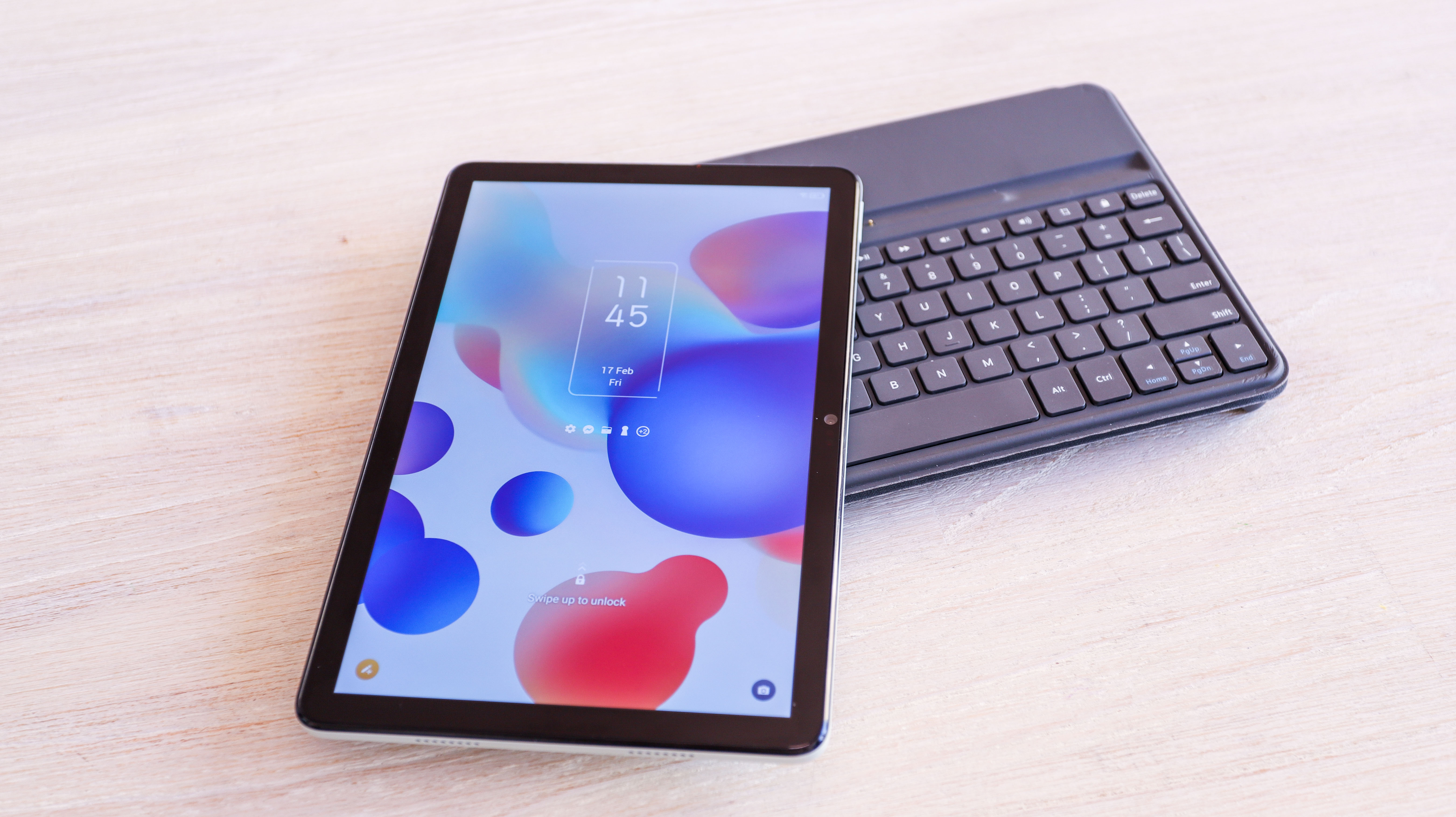 TCL Nxtpaper 10s on top of its keyboard folio
