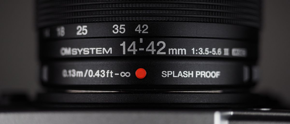OM System OM-3 with the OM System M.Zuiko 14-42mm 3.5-5.6 III on a wooden surface