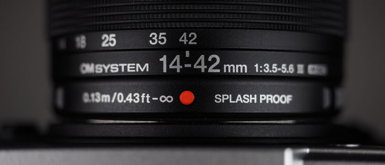 OM System OM-3 with the OM System M.Zuiko 14-42mm 3.5-5.6 III on a wooden surface