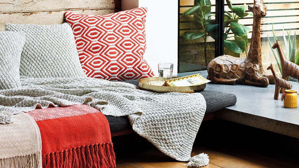 room with wooden flooring and geo woven cushion