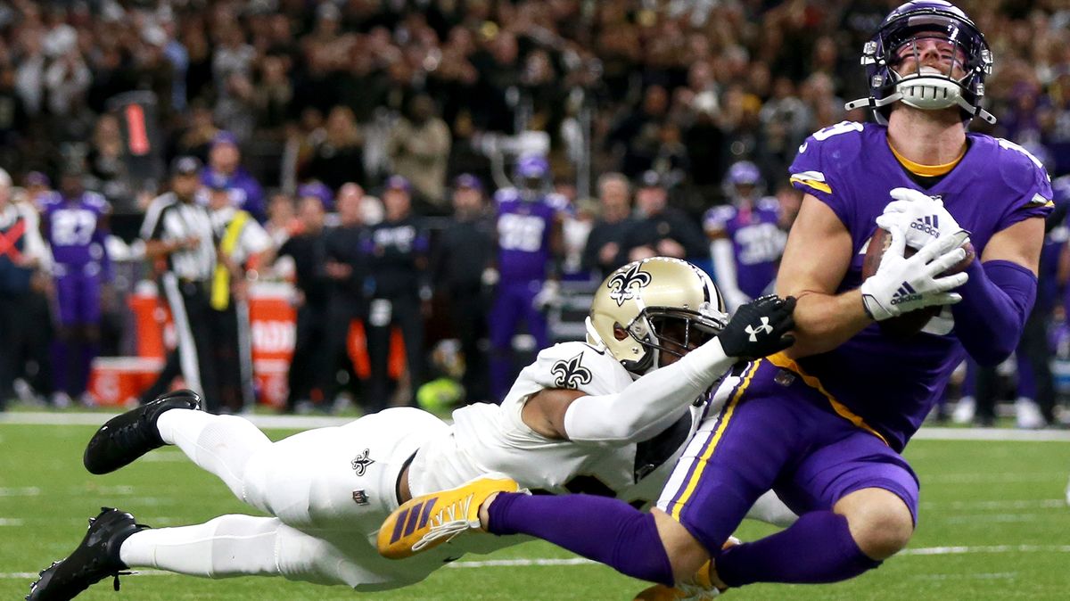 Adam Thielen #19 of the Minnesota Vikings catches a pass over Patrick Robinson #21 of the New Orleans Saints during the NFC Wild Card Playoff game at Mercedes Benz Superdome on Jan. 5, 2020 in New Orleans, Louisiana.