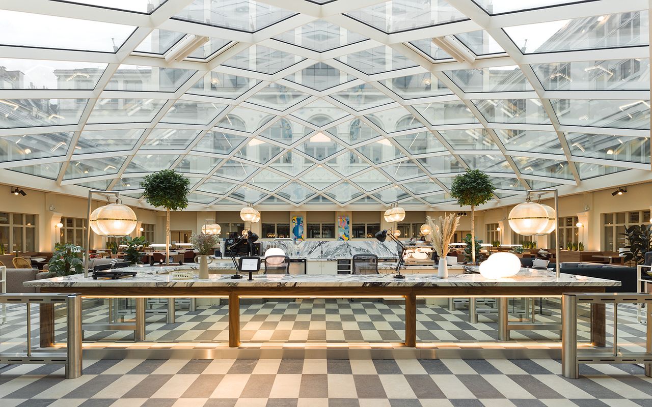 seating under glass roof, at WeWork 37 Avenue Trudaine - Paris