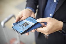 Person holding Covid passport on phone, which acts as proof of Covid-19 vaccine status