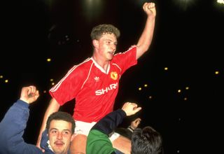 Mark Robins is lifted on the shoulders of Manchester United fans after scoring an extra-time winner against Oldham in the FA Cup semi-finals in April 1990.