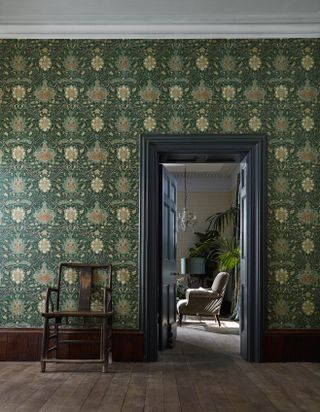 Dark green traditional wall paper in a period property
