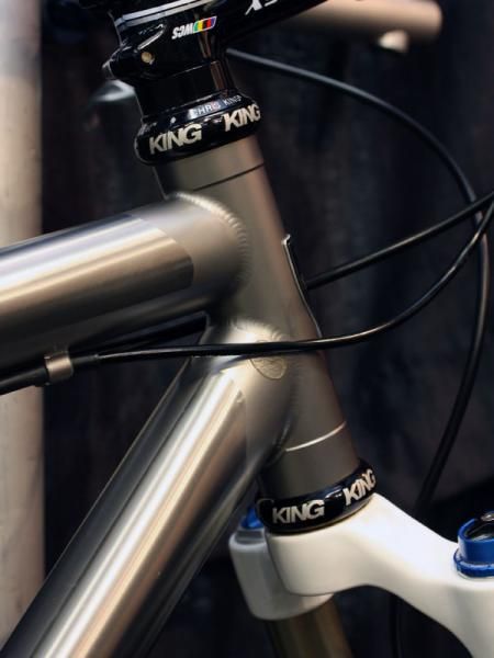 The frame features faux lugs created by selective masking and blasting.