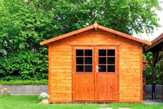 wooden shed in a summer backyard