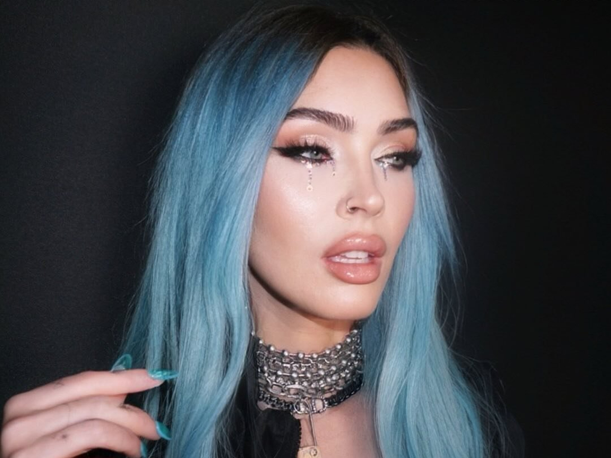 Megan Fox with blue hair and nails