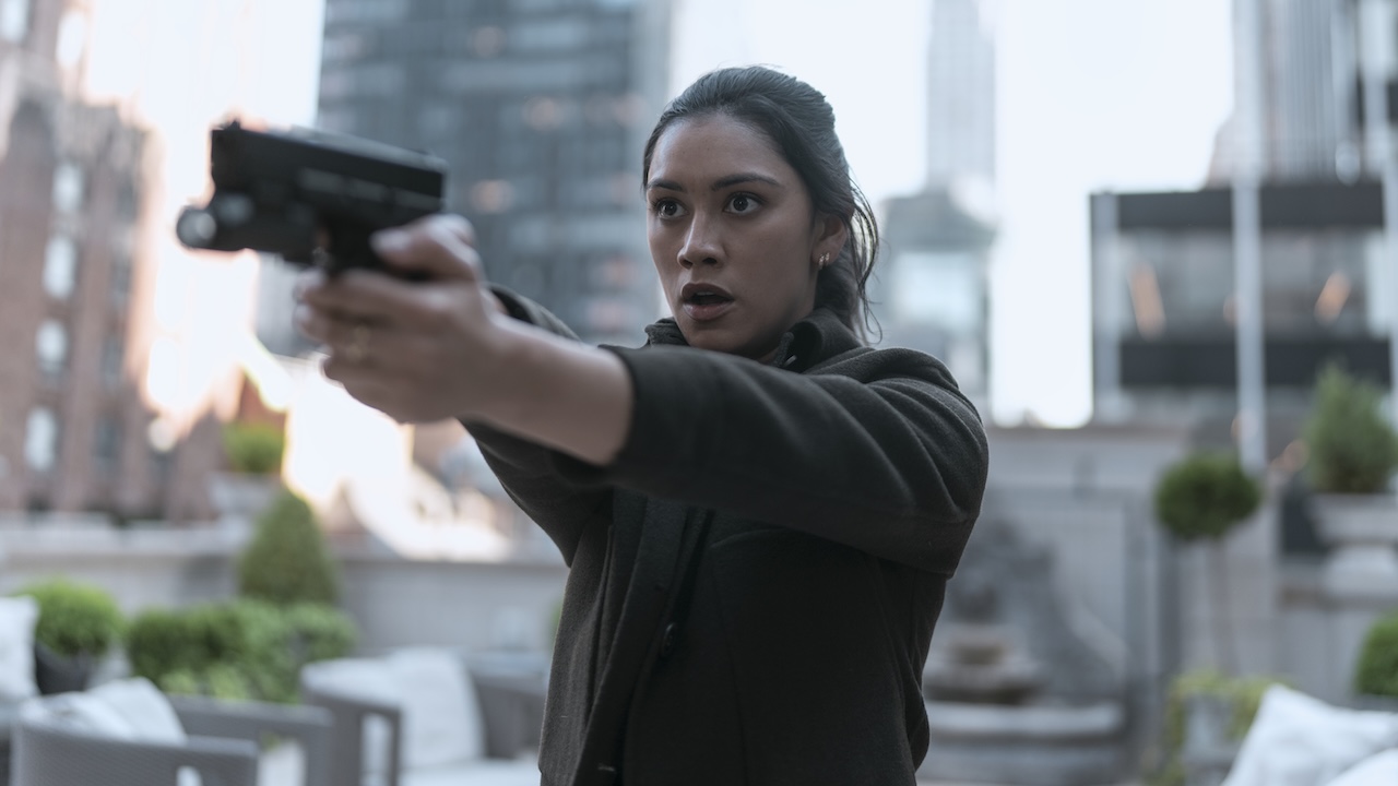 Rose Larkin pointing a gun at someone in The Night Agent Season 2