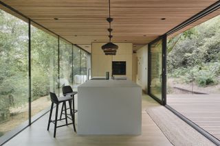Looking Glass Lodge by Michael Kendrick Architects interior with minimalist kitchen