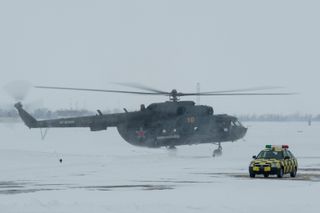A Russian MI-8 helicopter is seen at the Karanganda Airport shortly after poor weather forced the fleet of 12 helicopters to turn around from their flight to Zhezkazgan, Kazakhstan where they were to have pre-staged for the landing of the Soyuz TMA-10M sp