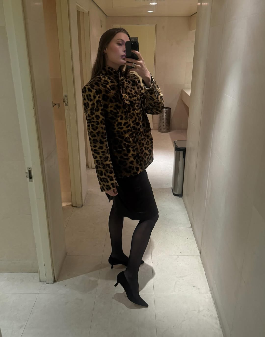 Woman wearing blazer and midi dress