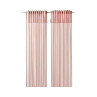 Light filtering drapes in soft pink, with double top layer