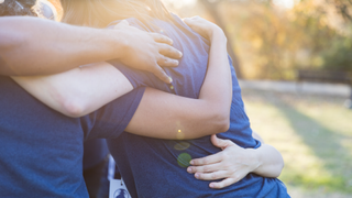 Group of volunteers hugging