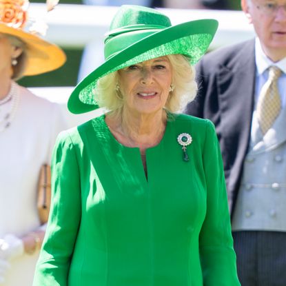 Queen Camilla wearing the Cambridge Cluster Emerald and Diamond Brooch at Royal Ascot 2025