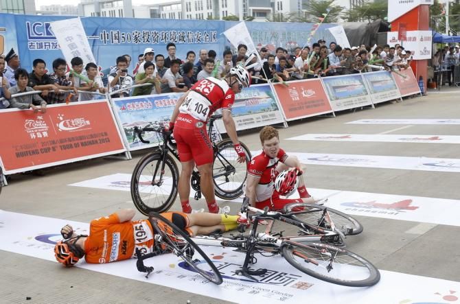 Riders on the ground after the finish of the final stage