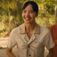 a preview of lisa from blackpink's character in the white lotus as a hotel staffer