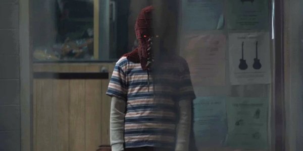 Brandon Breyer in his mask in a diner in Brightburn