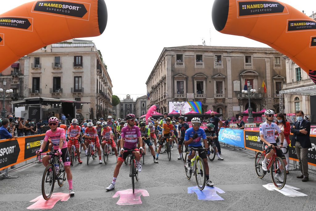 VILLAFRANCA TIRRENA ITALY OCTOBER 06 Start Joao Almeida of Portugal and Team Deceuninck QuickStep Pink Leader Jersey Diego Ulissi of Italy and UAE Team Emirates Purple Points Jersey Jonathan Caicedo Cepeda of Ecuador and Team EF Pro Cycling Blue Mountain Jersey Harm Vanhoucke of Belgium and Team Lotto Soudal White Best Young Rider Jersey Peloton Catania City during the 103rd Giro dItalia 2020 Stage 4 a 140km stage from Catania to Villafranca Tirrena girodiitalia Giro on October 06 2020 in Villafranca Tirrena Italy Photo by Tim de WaeleGetty Images