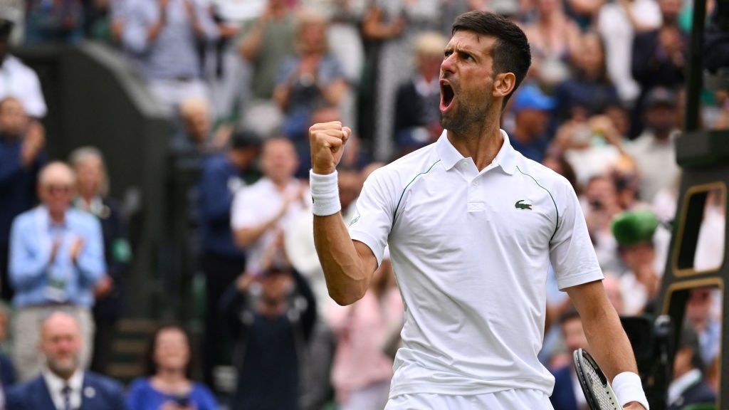 Serbia&#039;s Novak Djokovic celebrates winning against Italy&#039;s Jannik Sinner during their men&#039;s singles quarter final tennis match on the ninth day of the 2022 Wimbledon Championships 