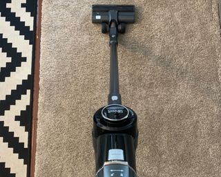 Levoit vacuum being used on carpet at home during testing