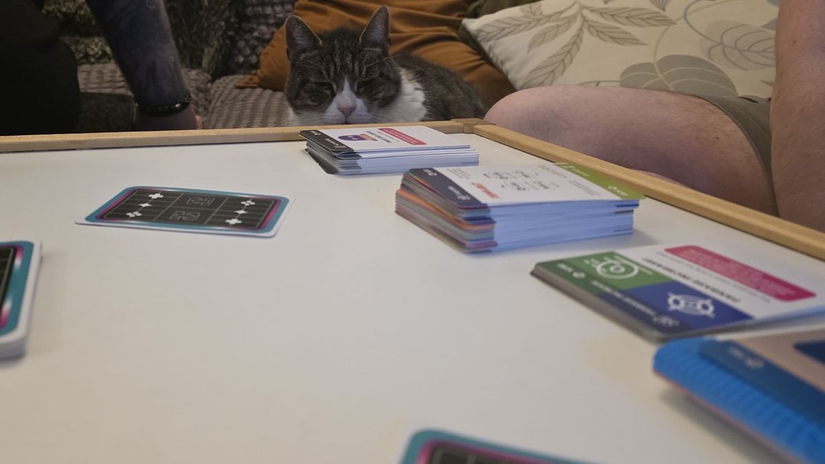 Cards from Console Wars the game laid out on a table during a game
