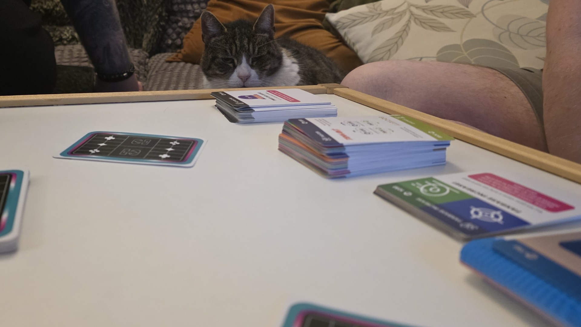 Cards from Console Wars the game laid out on a table during a game