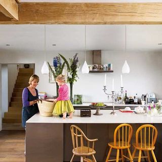kitchen with womend and child