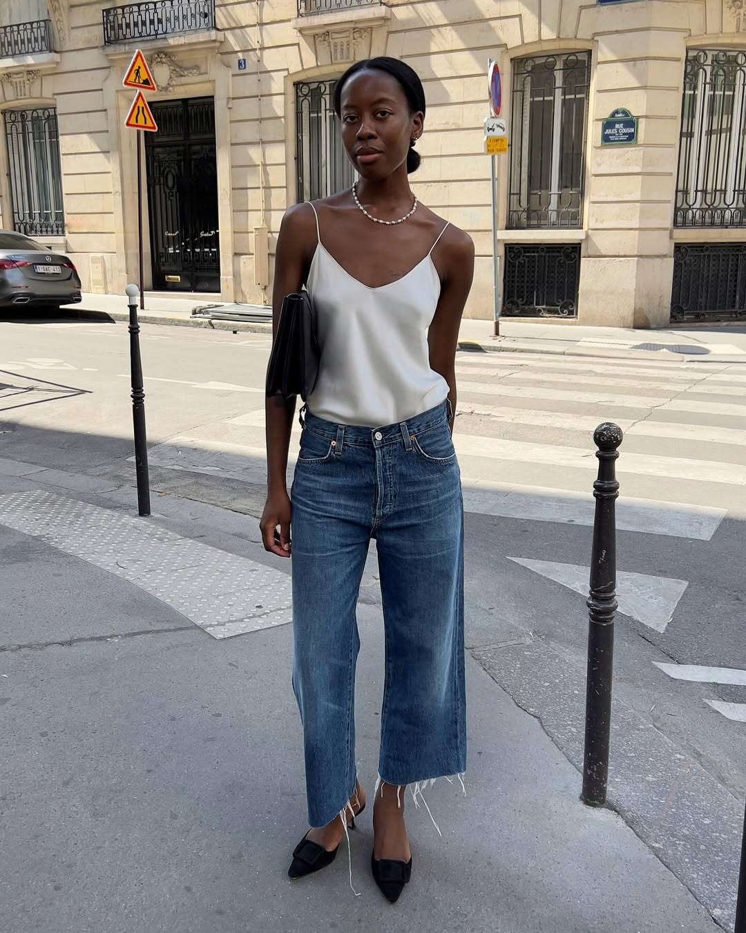 Woman in jeans and a silky camisole