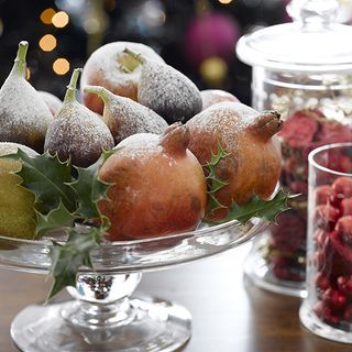 decorate frosted fruit and storage jars on dining table