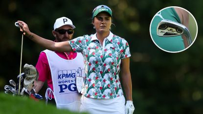 Lexi Thompson takes a club from her bag