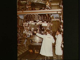 Hughes Aircraft Technicians Work on Telstar 3