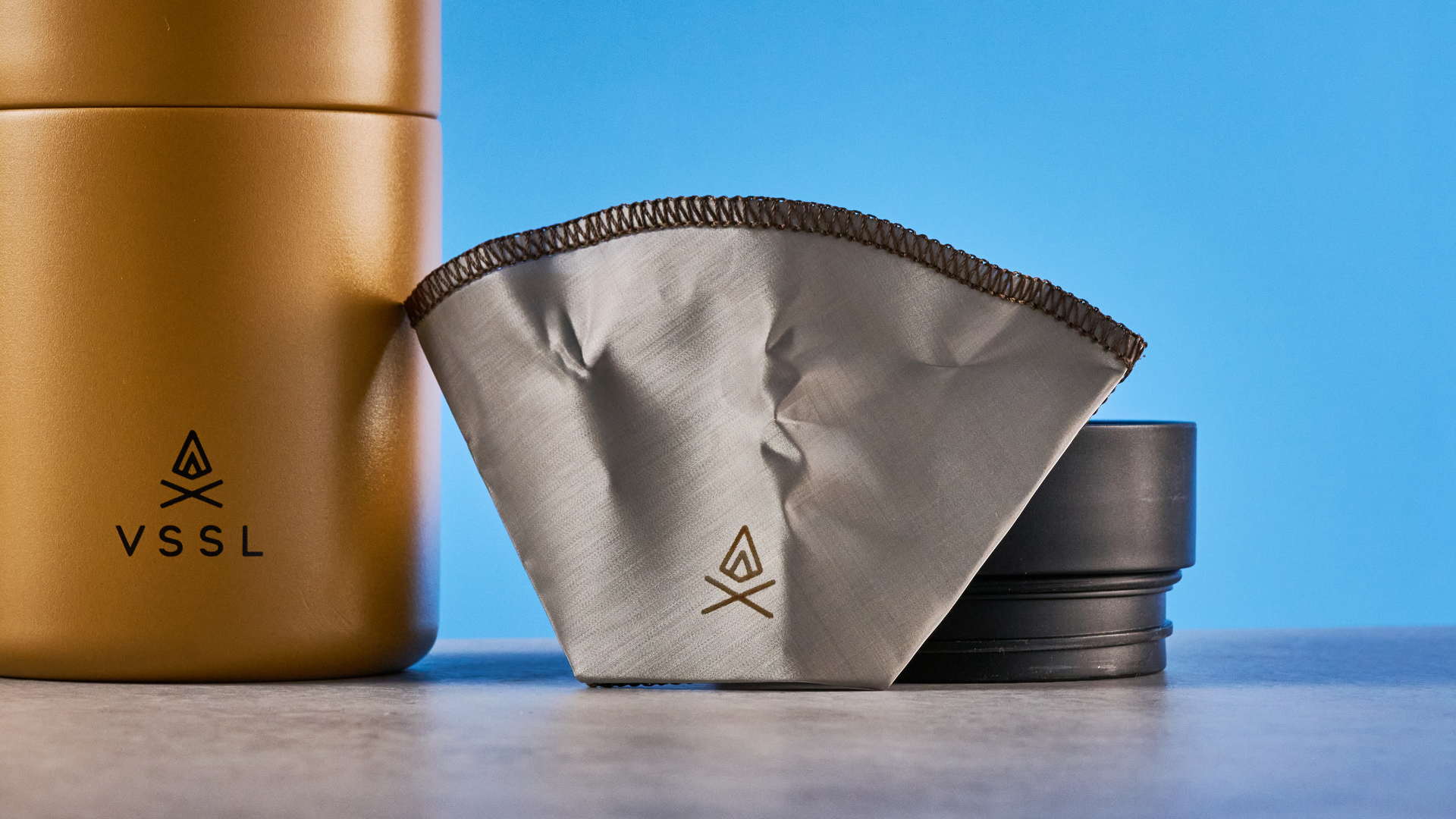 the VSSL Nest Pour Over Coffee Set in gold photographed against the blue tom's guide background