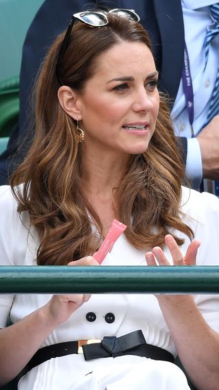 Catherine, Princess of Wales attends day two of the Wimbledon Tennis Championships in 2019 and is pictured holding a Clarins Lip Perfector