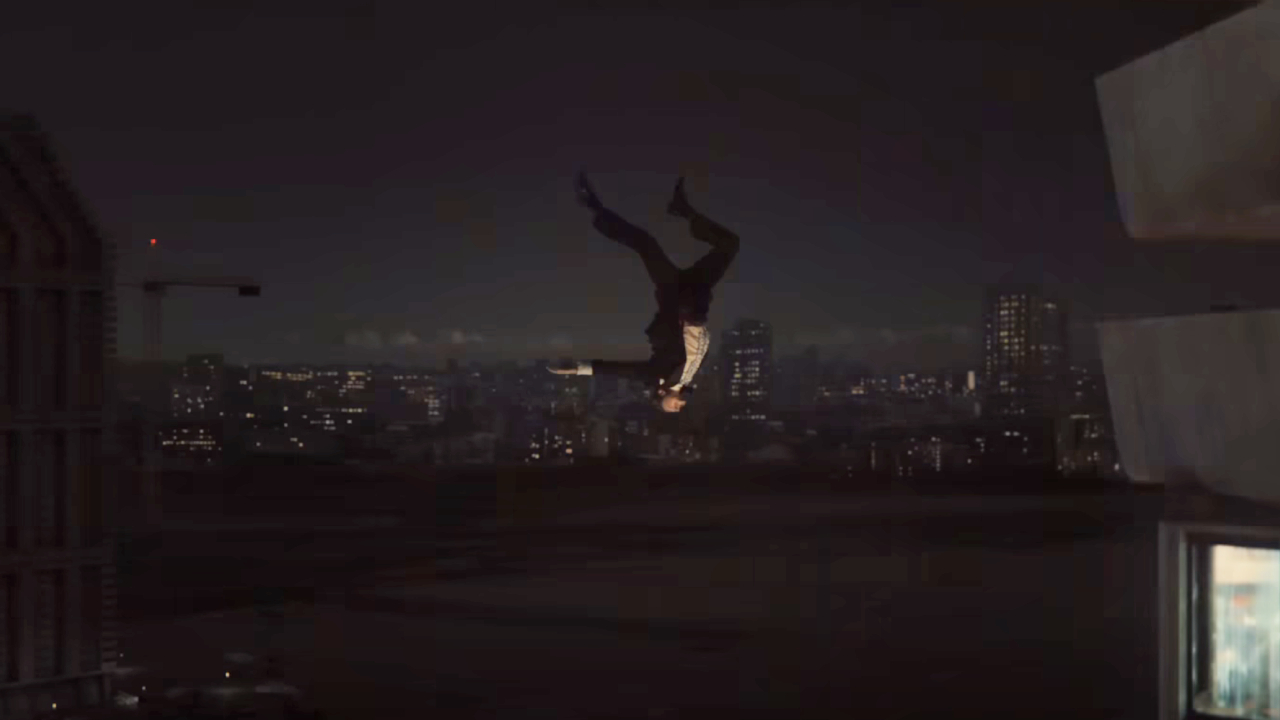 A man falls from a skyscraper at night in High-Rise