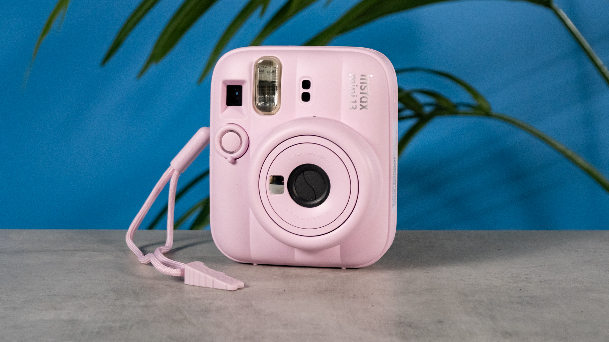 A Candy Pink Fujifilm Instax mini 13 instant camera