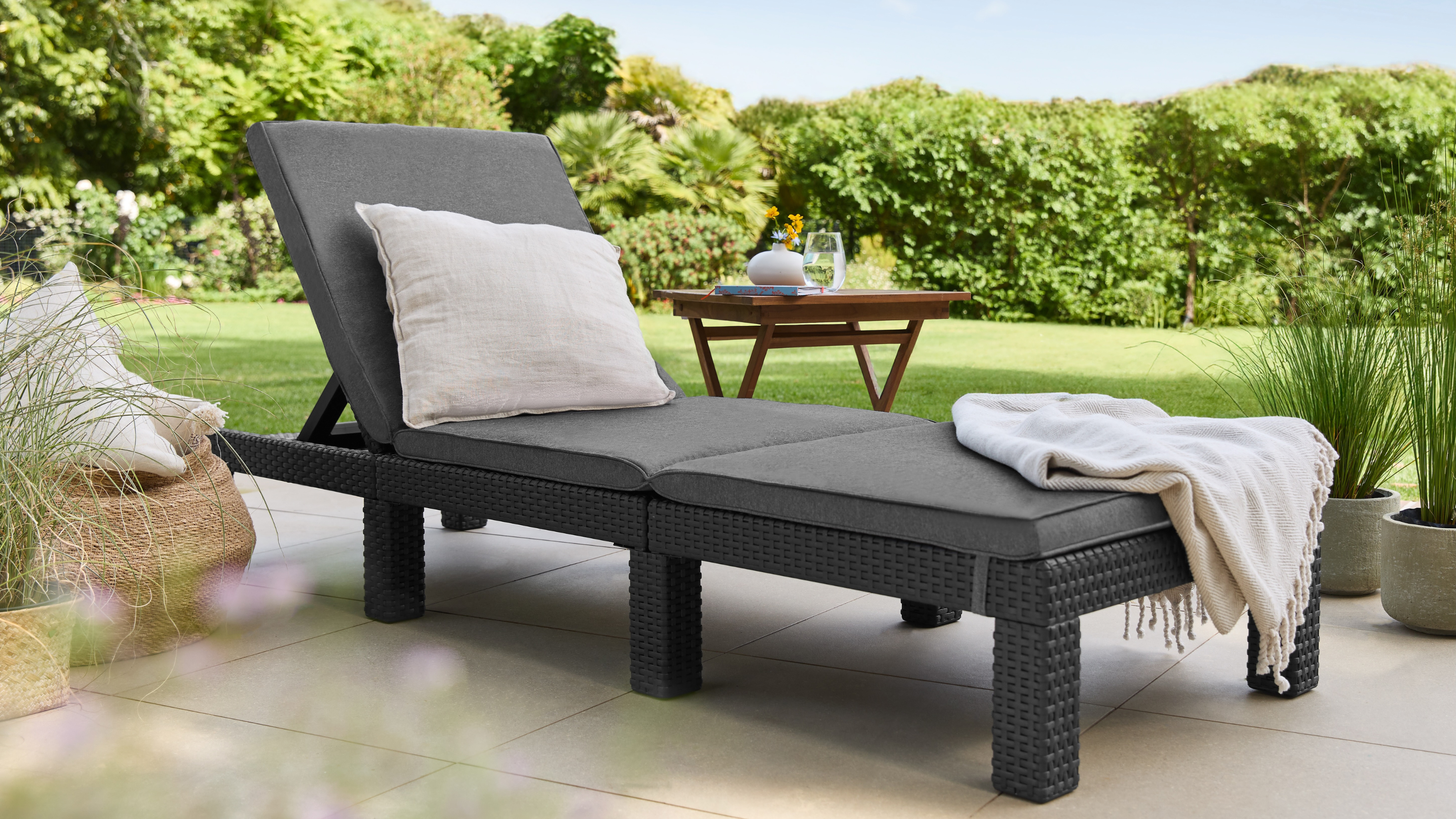 Lidl wicker sun lounger on a patio.